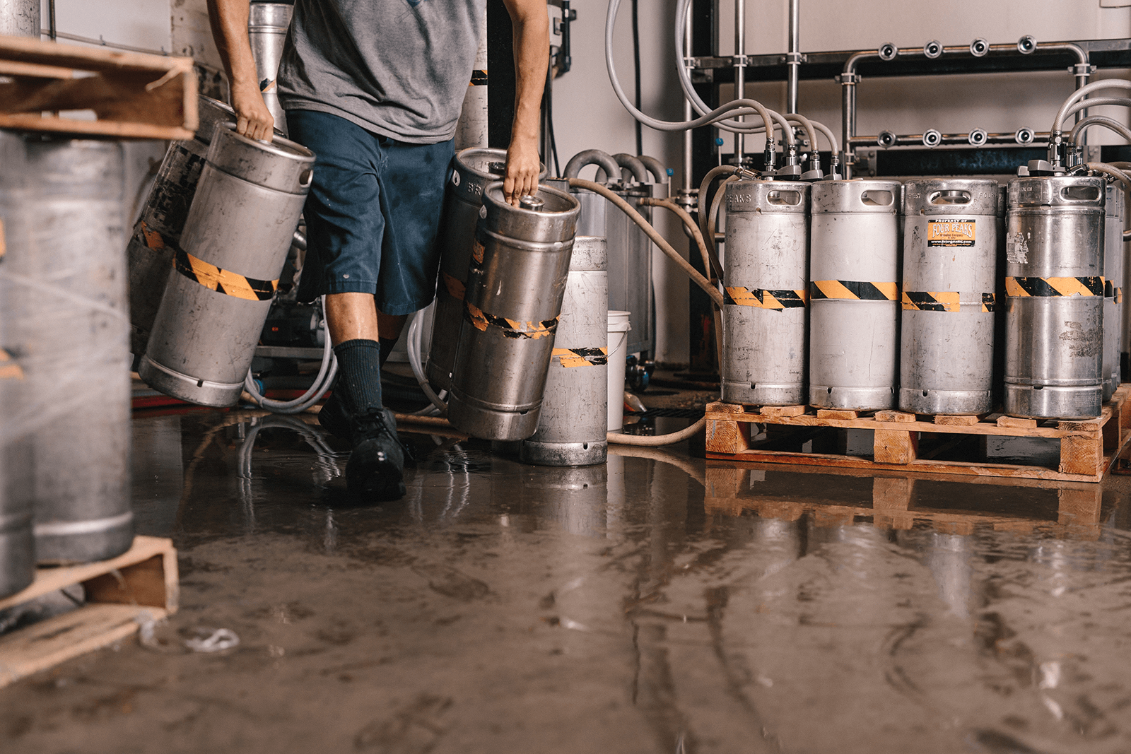 Brewery worker carrying a keg